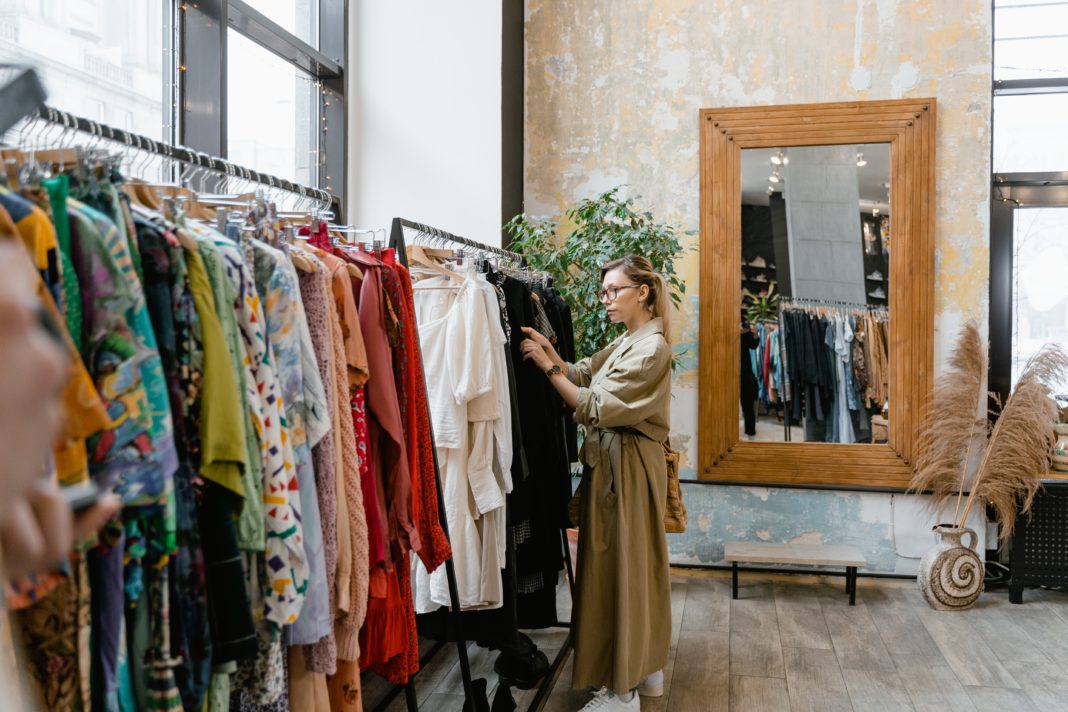 Woman shopping in clothing boutique.